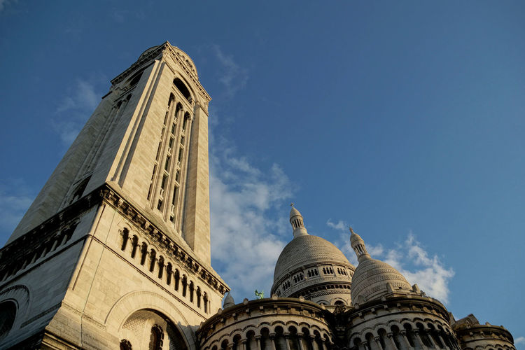 Low angle view of basilique du sacre coeur against blue sky