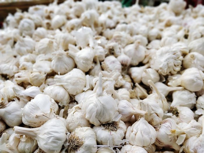 Full frame shot of white garlic for sale