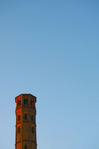 Low angle view of historic tower against clear sky