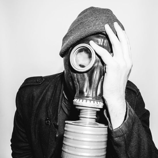 Portrait man wearing a gas mask
