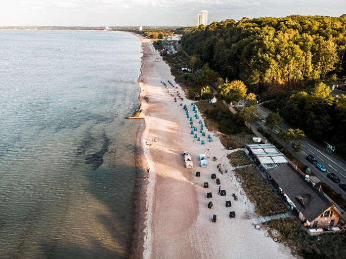 Aerial drone view over the east sea in germany with beach huts.