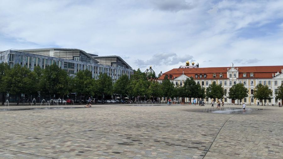 Buildings in city against sky