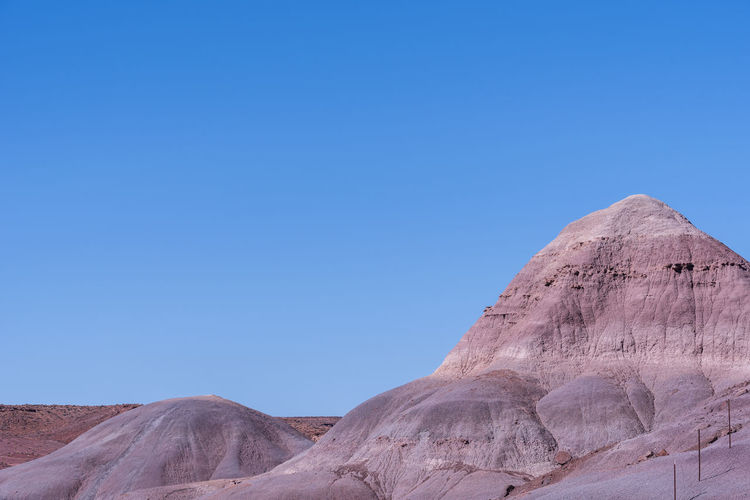 Barren purple and white badlands at blue mesa in petrified forest national park in arizona