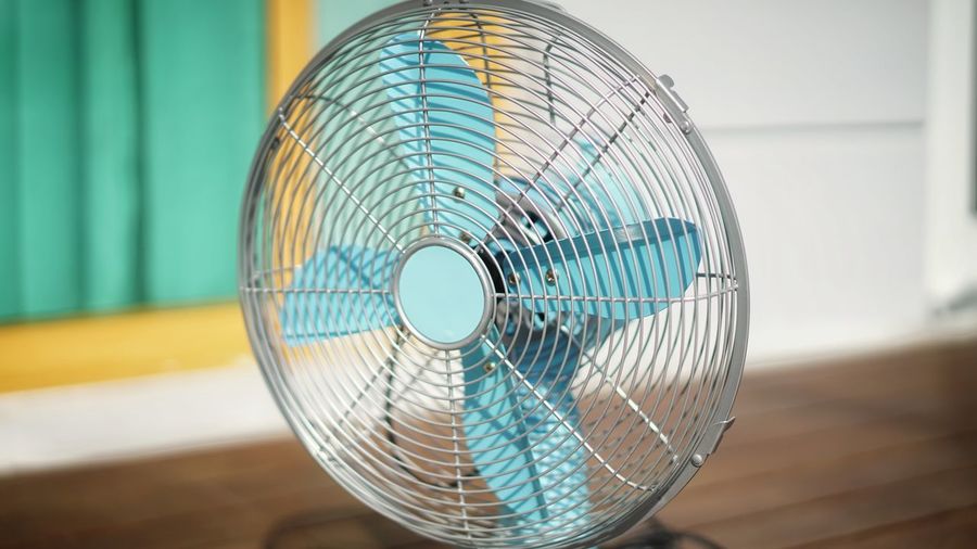 Close-up of electric fan on table