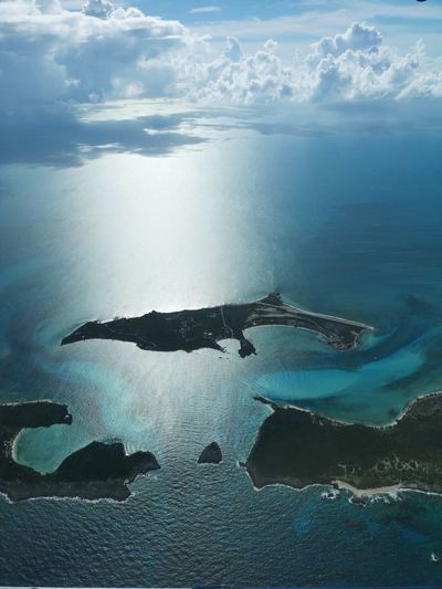 Aerial view of island in sea against sky