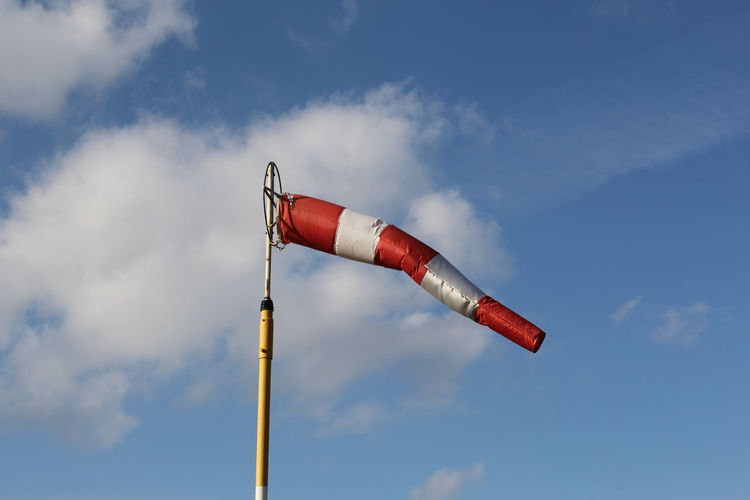 Low angle view of wind sock against sky