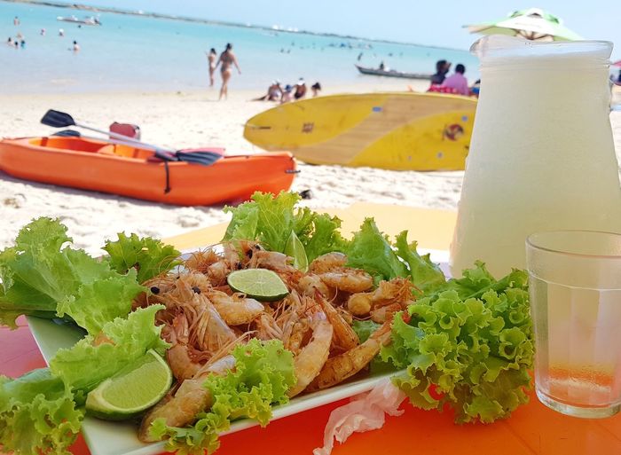 Close-up of food on table at beach