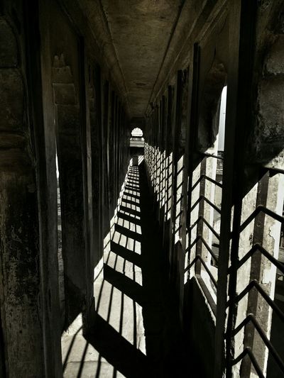 Narrow corridor with shadow pattern
