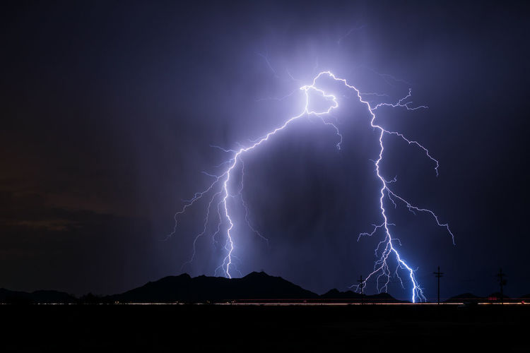 A dramatic lightning strike from a storm over casa grande, arizona.