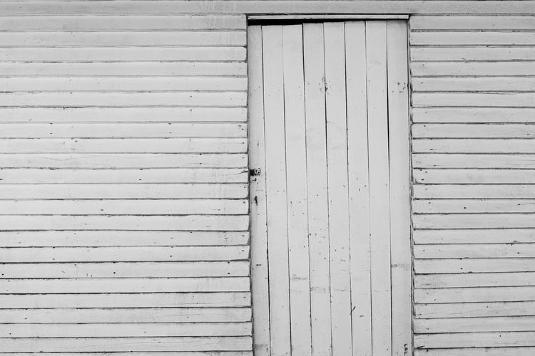 Full frame shot of closed shutter of old building