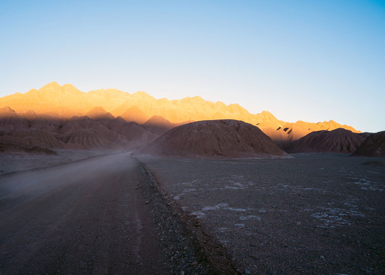 Scenic view of desert against clear sky