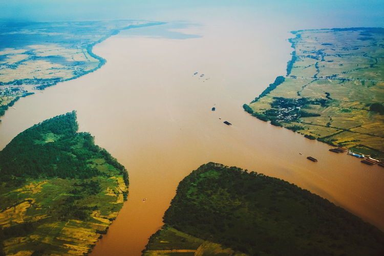 Aerial view of river passing through landscape