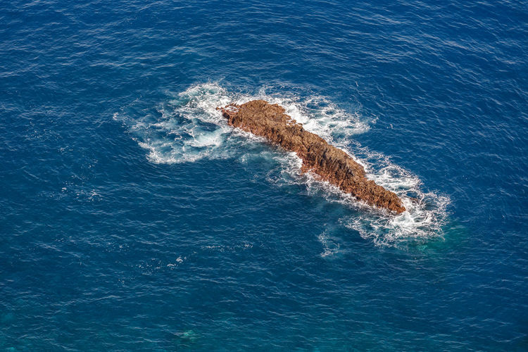  high angle view of rock in the sea