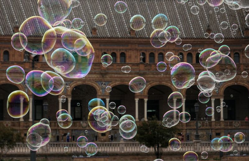 Multi colored bubbles against building
