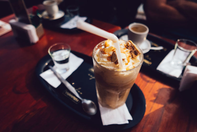 High angle view of cold coffee served on table