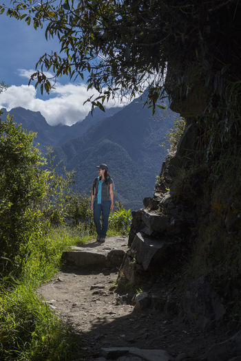 Woman hiking on the inca trail close to machu picchu