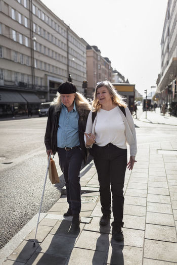 Senior couple walking in street
