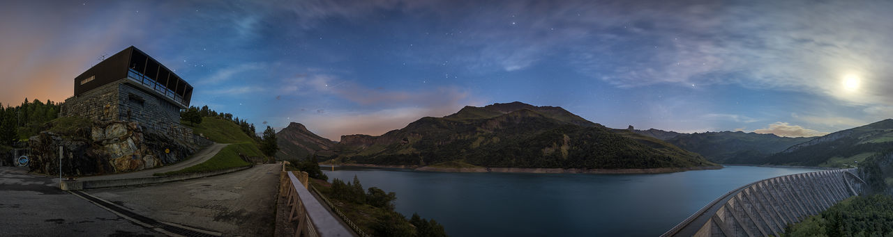 Panoramic view of lake and mountains against sky at night