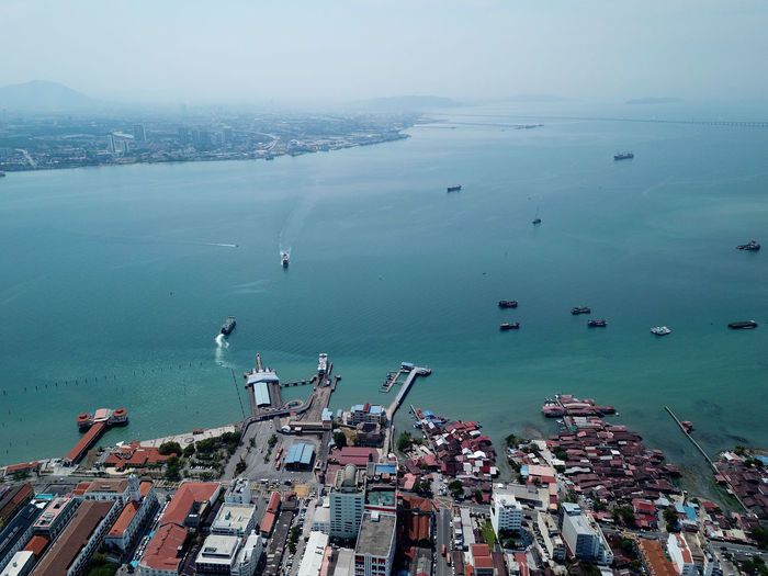 Aerial view two ferry move at penang sea.