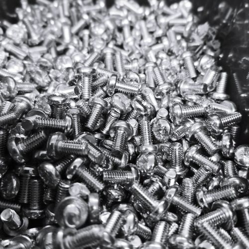 Close-up of screws in factory