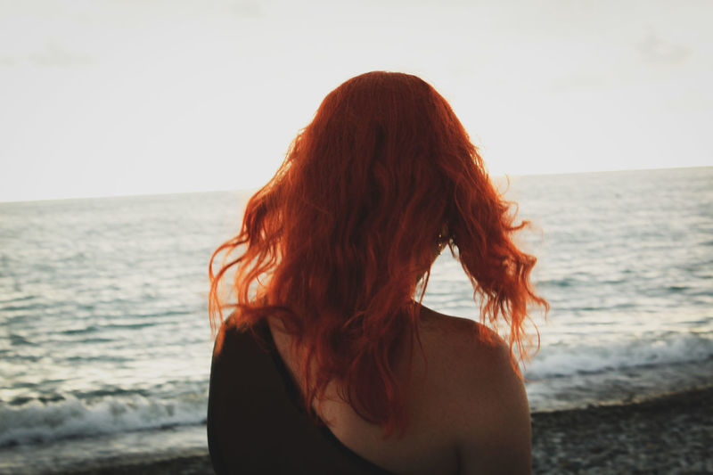 redhead looking out at sea
