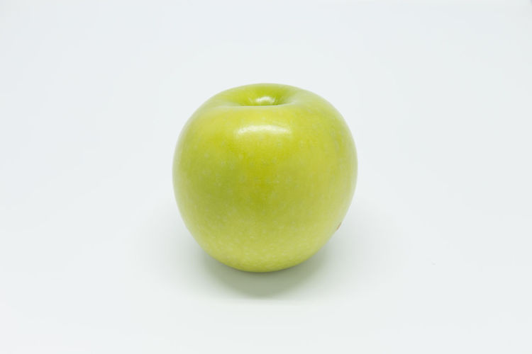 Close-up of apple against white background