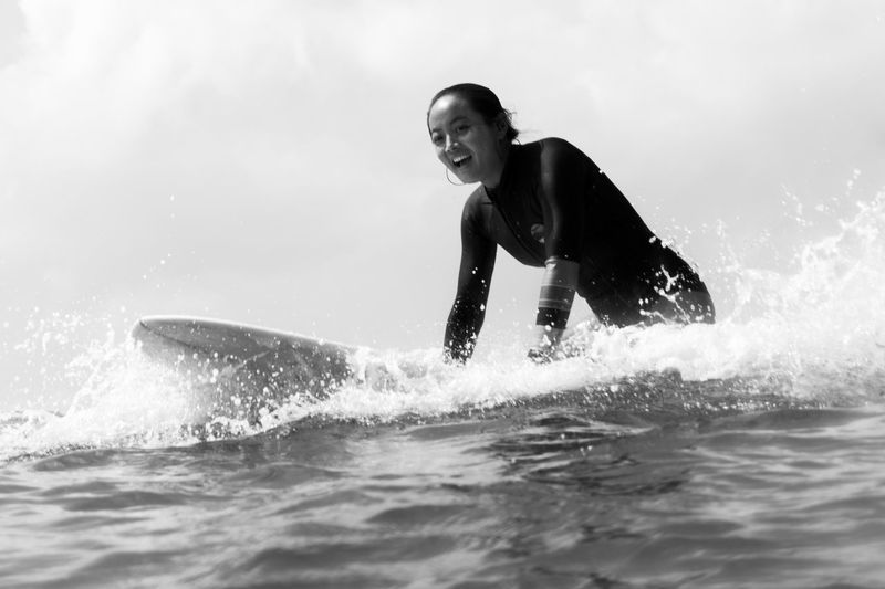 Side view of man surfing in sea