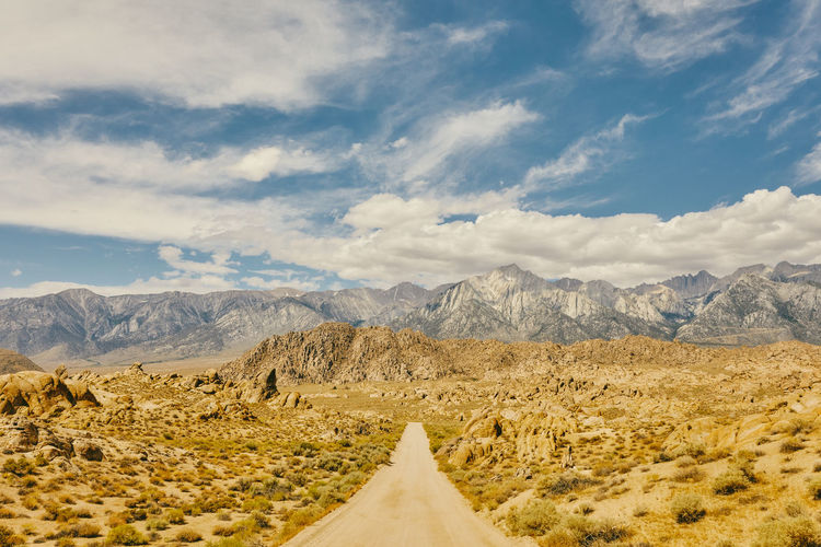 Deserted road near foothills of alabama hills in northern califonia.