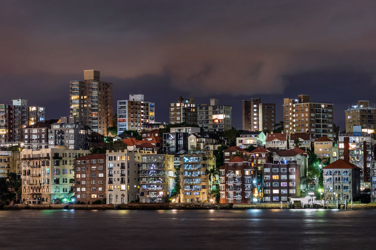 Residential and commercial buildings at sydney harbor at night, australia.