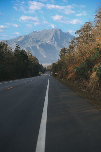Empty road against sky