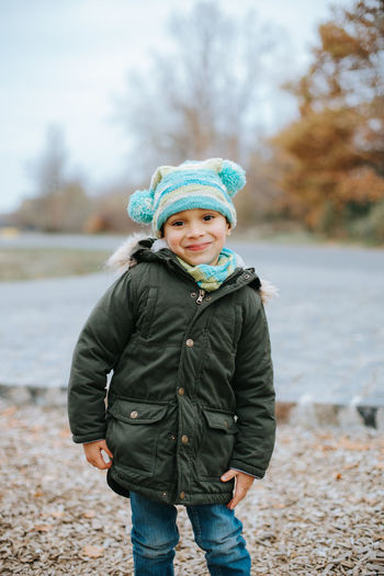 Full length of boy wearing hat during winter