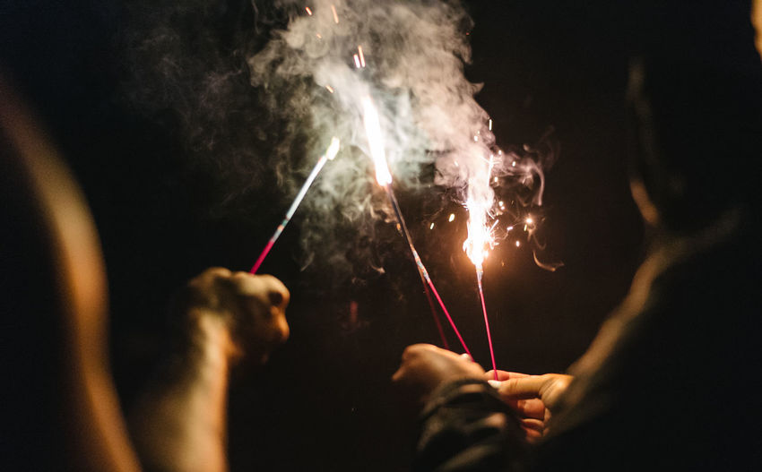 Man and woman burning at night