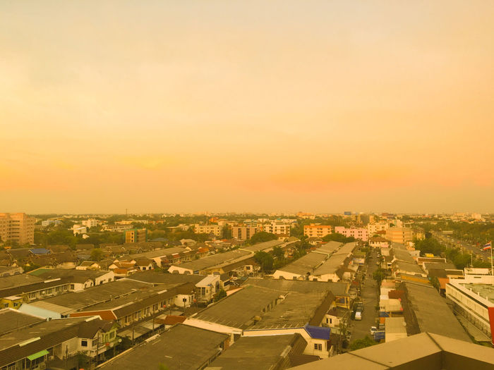 High angle view of townscape against clear sky during sunset
