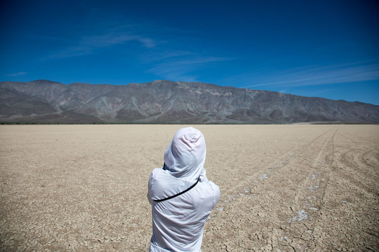 Man on landscape against mountain range
