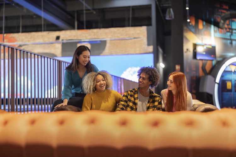 Diverse friends enjoying at bowling alley