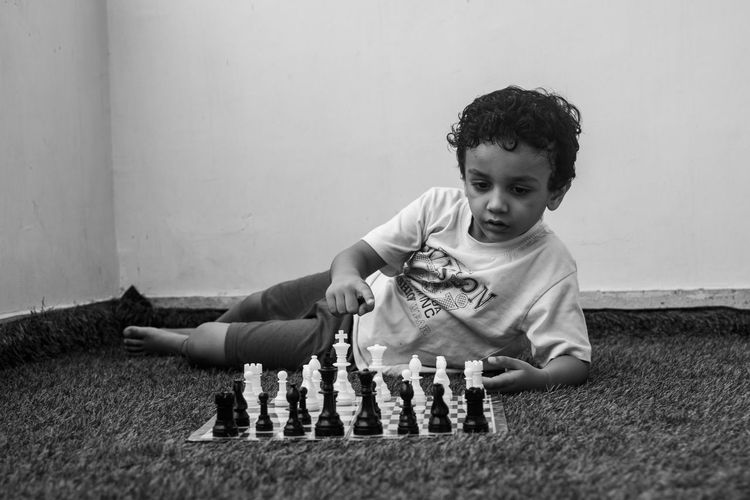 Boy learning chess