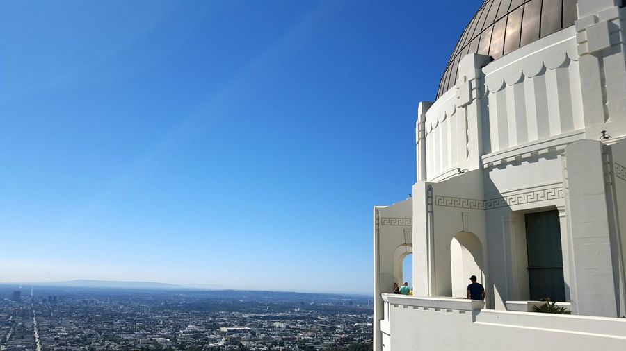 Griffith park observatory against clear blue sky on sunny day