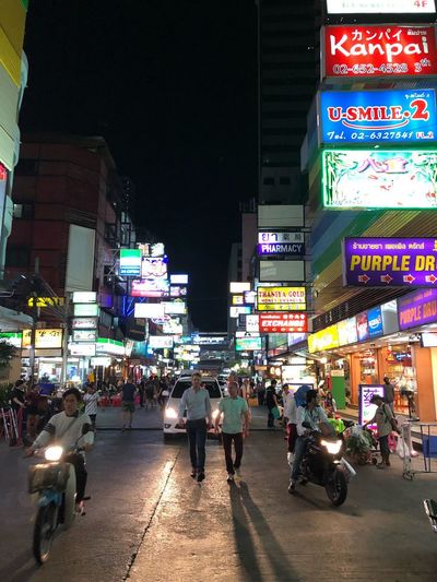 People on city street at night