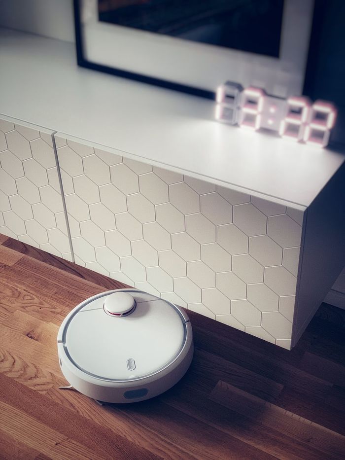 High angle view of robotic vacuum cleaner at home