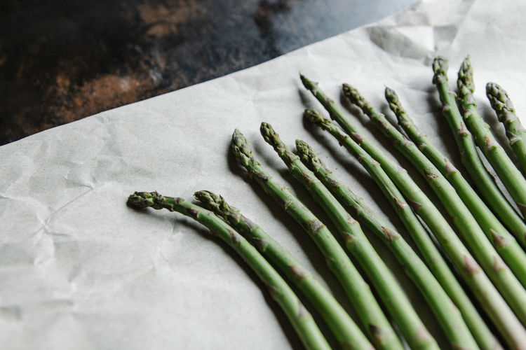 Bunch of green asparagus on paper