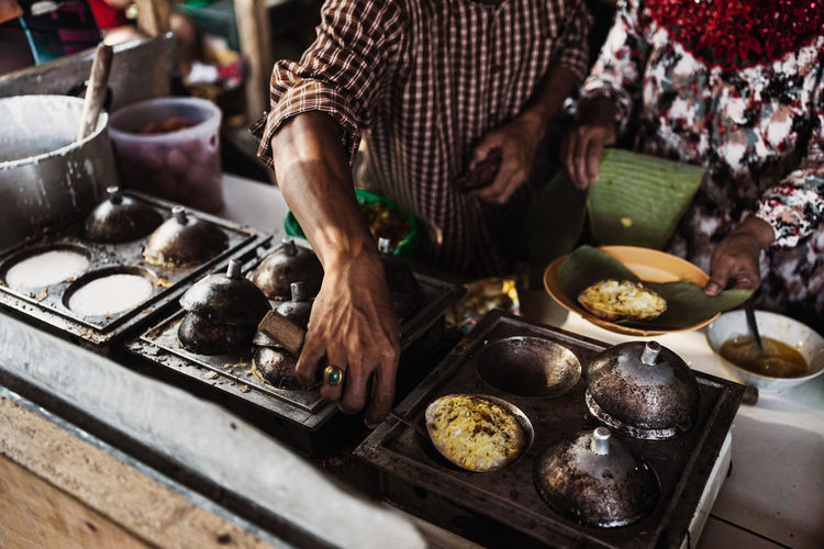 A chef cooks surabi, sundanese traditional food 