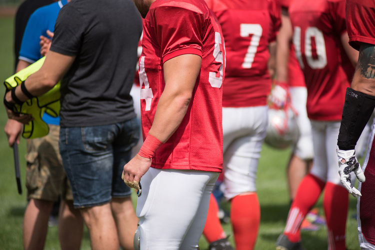American football player walking on playing field