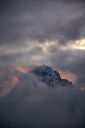 Scenic view of snowcapped mountain against sky during sunset