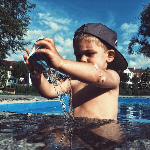 Boy playing in swimming pool
