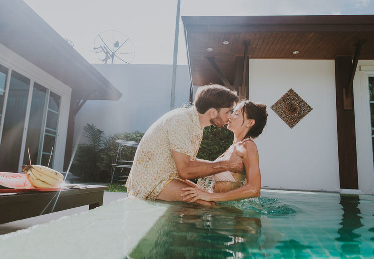 Couple kissing in swimming pool