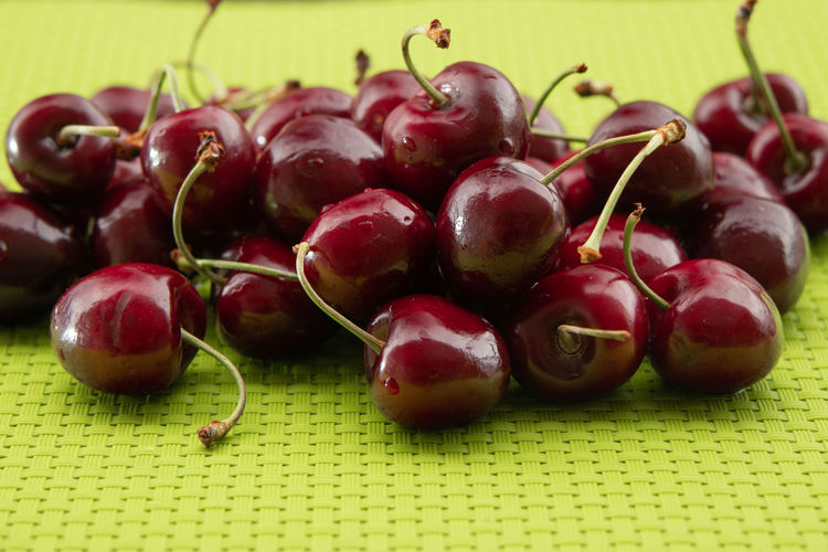 Close-up of cherries on table
