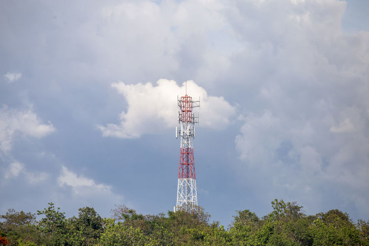 Low angle view of communications tower against sky