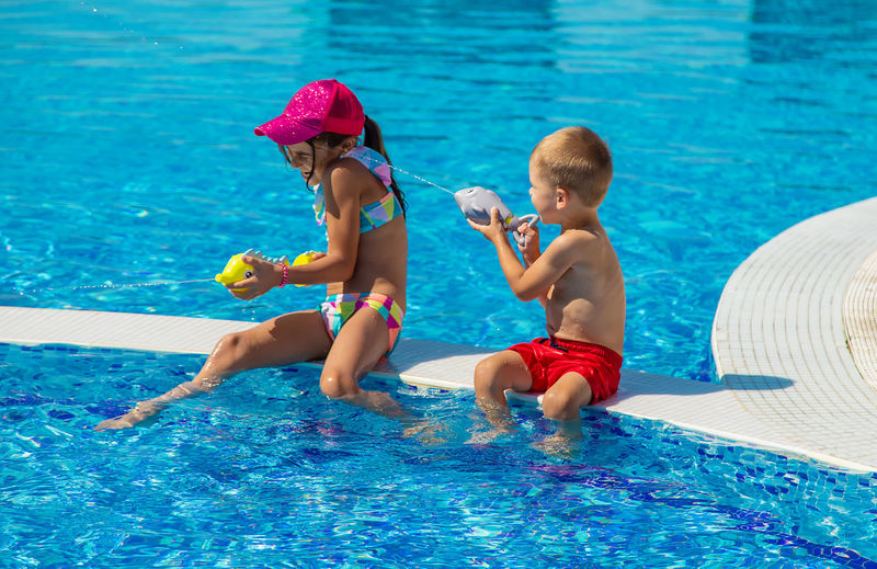 Rear view of woman in swimming pool