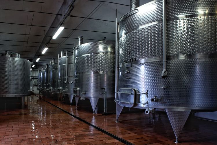 Wine tanks in the tuscan cellar. 
