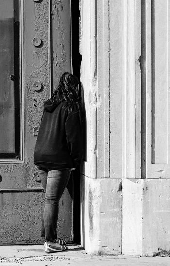 Woman in front of door
